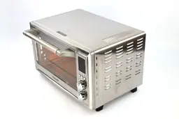 On a white background, the top, front, and right sides of the Cosori CO130-AO Toaster Oven have air ventilation holes.