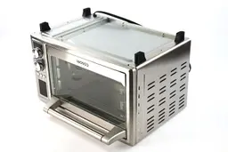 On a white background, the bottom of the Cosori CO130-AO Oven has a power cord, four stands, and air ventilation holes.