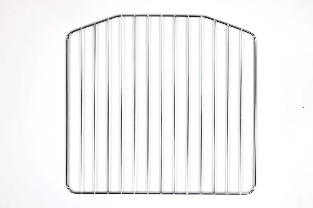 A stainless steel baking rack of the Cosori CO130-AO 30L 12-In-1 Dehydrator Rotisserie Toaster Oven on a white background.