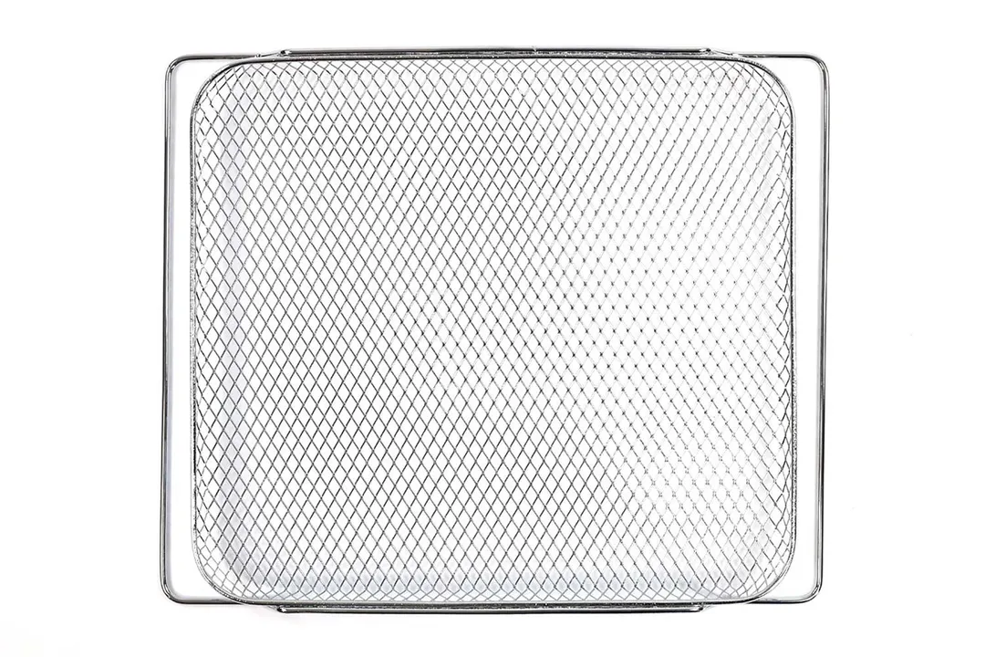 A stainless steel air fryer basket of the Cosori CO130-AO 30L 12-In-1 Dehydrator Toaster Oven on a white background.