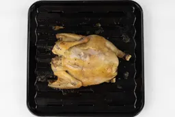 Breville Smart Oven Pro Toaster Oven Whole Roasted ChickenA whole roasted chicken using the Breville BOV845BSSUSC Toaster Oven backside up on an enamel broiling rack and baking pan.