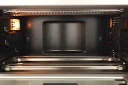 Breville Smart Oven Pro Toaster Oven InteriorBreville BOV845BSSUSC has 4 quartz heating elements with guards, 3 guide rails with safety hooks, a light, and a fan cavity.