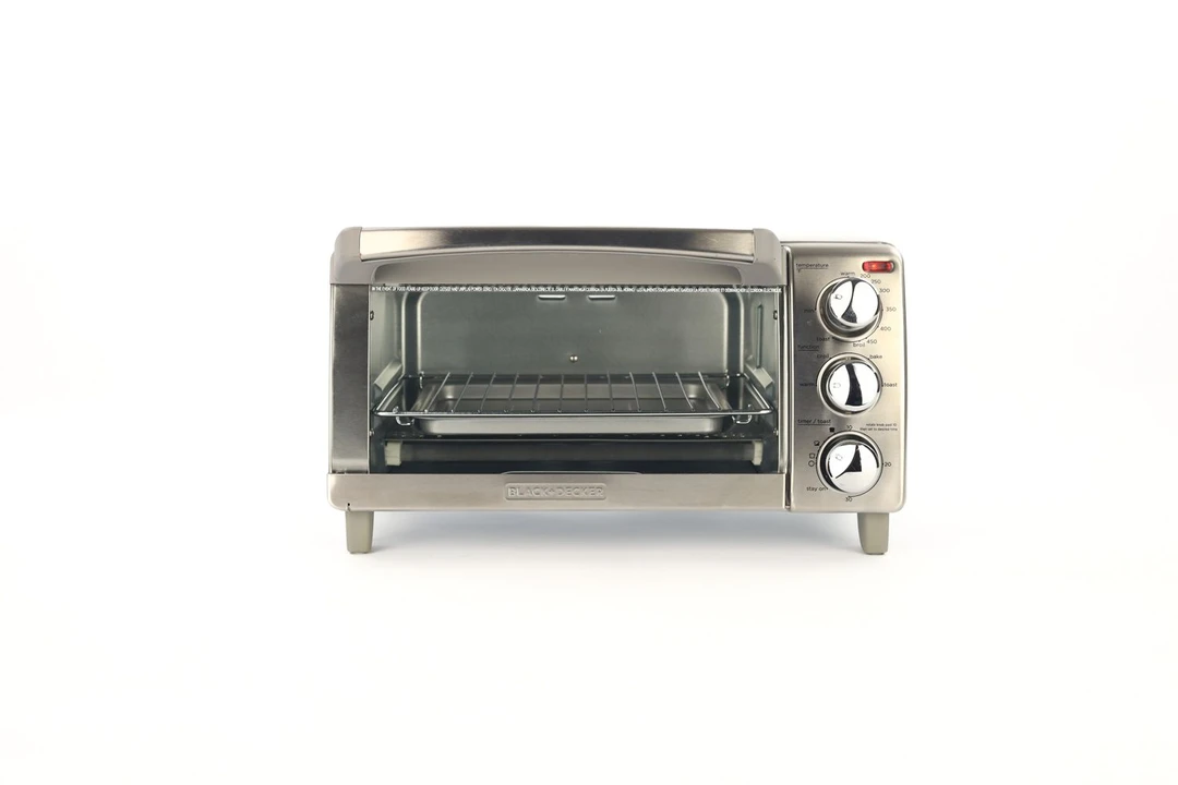 The front of a closed stainless steel Black+Decker TO1760SS 4-Slice Natural Convection Toaster Oven on a white background.
