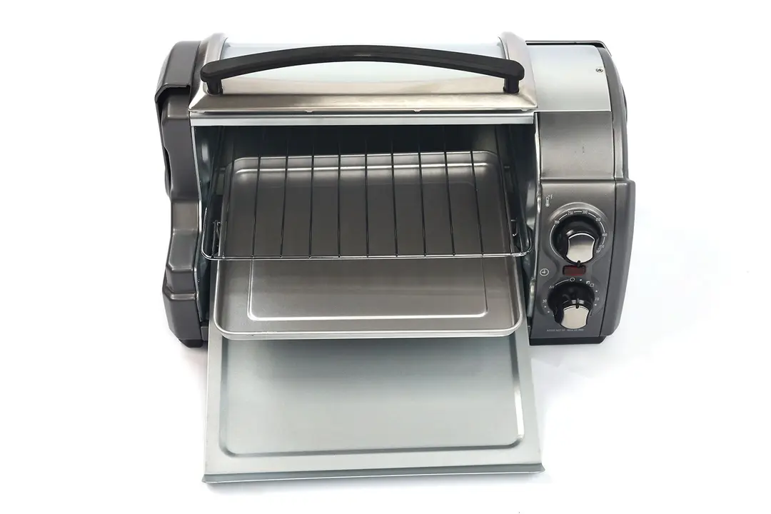 The front of an opened Hamilton Beach 31344DA 4-Slice Toaster Oven with a removable crumb tray, baking pan, and oven rack.