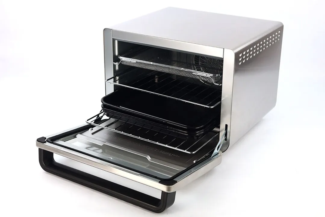 The front of an opened Ninja DT201 with a removable crumb tray, broiling rack, air fryer basket, 2 oven racks, 2 baking pans.