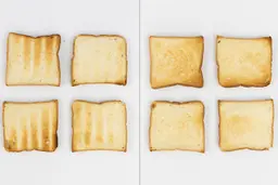 The top and bottom of the best four pieces of toast from the stainless steel Mueller MT-175 4-Slice Countertop Toaster Oven.