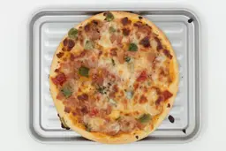  Mueller 4 Slice Toaster Oven PizzaA toaster oven baked 9-inch thick-crust meat pizza with cheese, onions, and green bell peppers on top inside a baking pan.