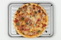  Mueller 4 Slice Toaster Oven PizzaA toaster oven baked 9-inch thick-crust meat pizza with cheese, onions, and green bell peppers on top inside a baking pan.