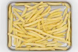 Mueller 4 Slice Toaster Oven Baked French FriesPieces of baked french fries using the Mueller MT-175 Toaster Oven on a grooved silver baking pan on a white background.