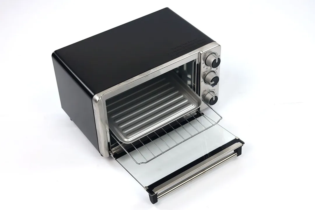 The front of an opened stainless steel Mueller MT-175 4-Slice Countertop Toaster Oven with an oven rack and baking pan.