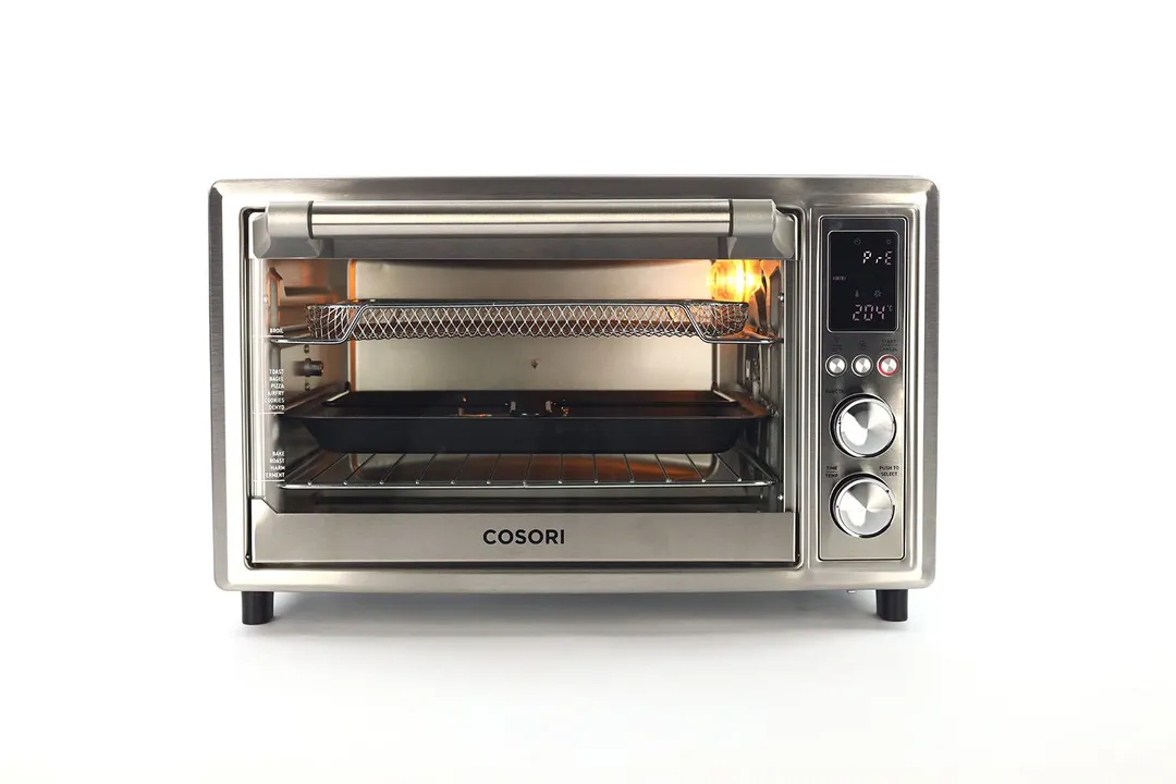 The front of a closed Cosori CO130-AO 30L 12-In-1 Dehydrator Air Fryer Rotisserie Toaster Oven on a white background.