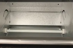 The rack-pulling mechanism and bottom quartz ceramic heating element inside the Panasonic NB-G110P Oven’s cooking chamber.
