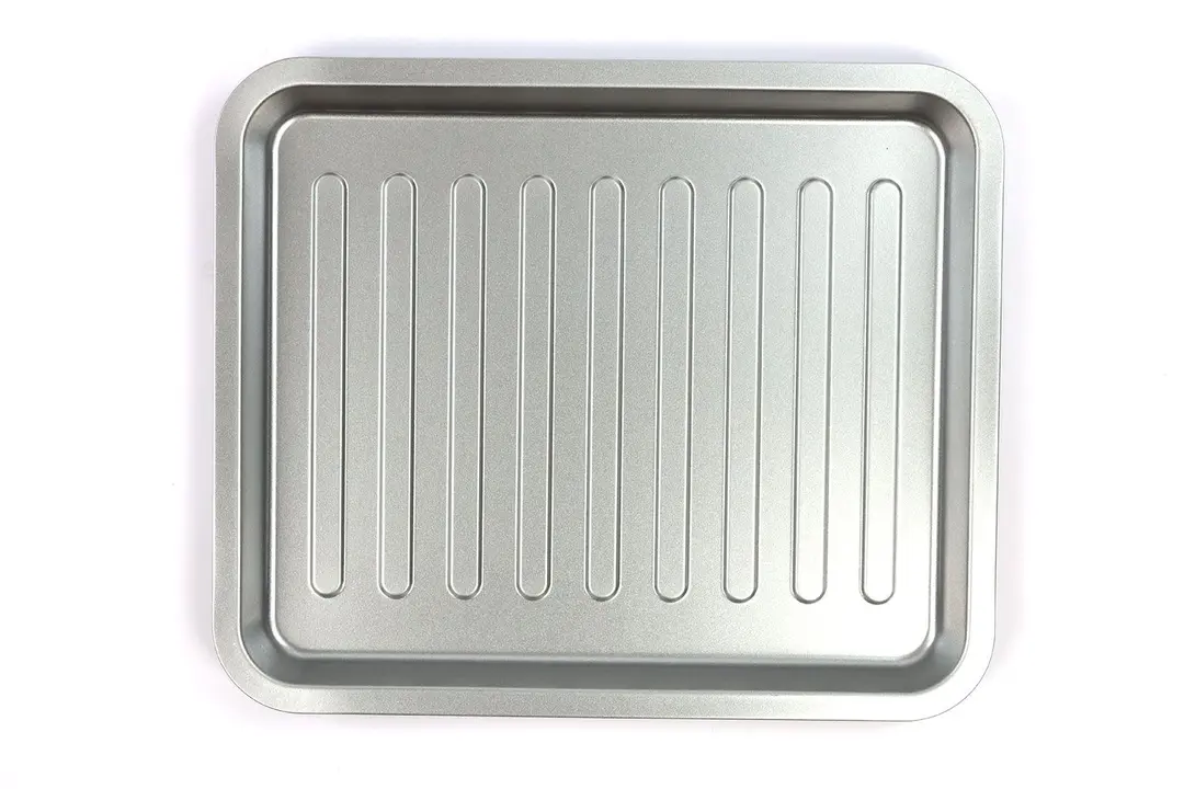 A silver baking pan of the Oster TSSTTVFDDG XL Digital French Door Convection Toaster Oven on a white background.