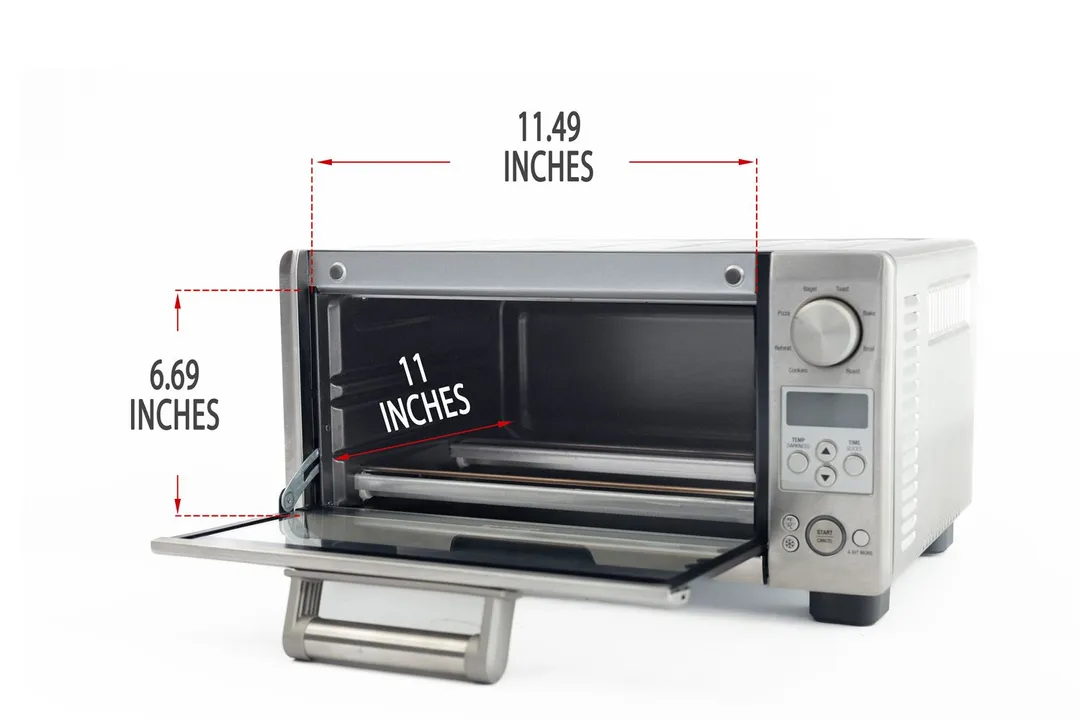An opened front of the Breville BOV450XL Mini Smart Toaster Oven with interior measurements on a white background.