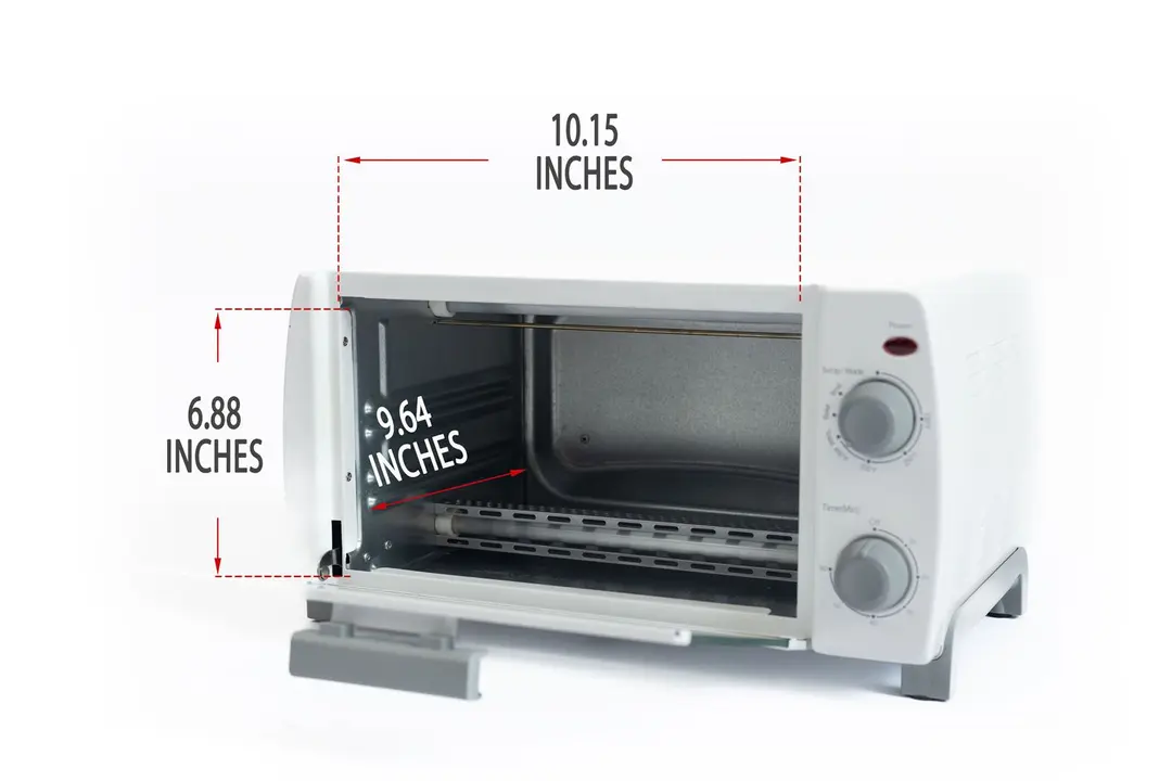 An opened front of the white Comfee CFO-BB101 Compact Toaster Oven with interior measurements on a white background.