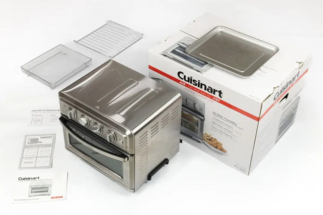 Top to bottom and left to right are a baking rack, baking pan, three documents, the Cuisinart TOA-60 Convection Toaster Oven Air Fryer, and a box.
