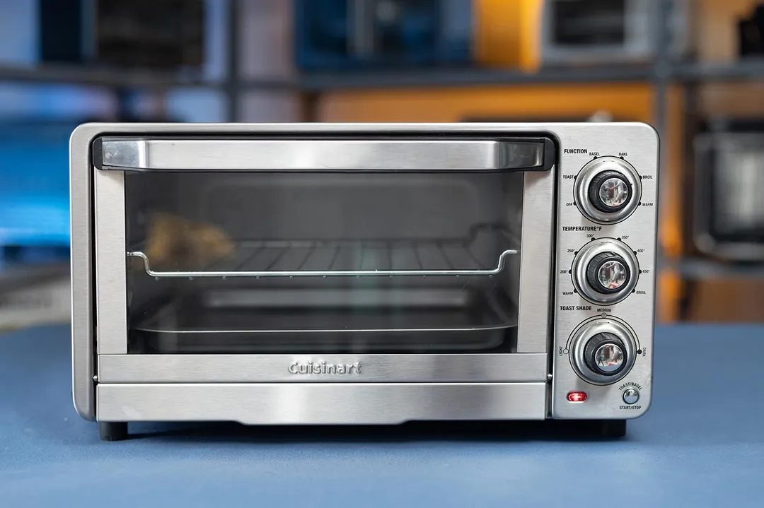 The front of a closed stainless steel Cuisinart TOB-40N Custom Classic Toaster Oven Broiler on a white background.