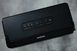 The control panel of the Anova Precision Pro, with function buttons arranged neatly in a row in three distinct groupings.