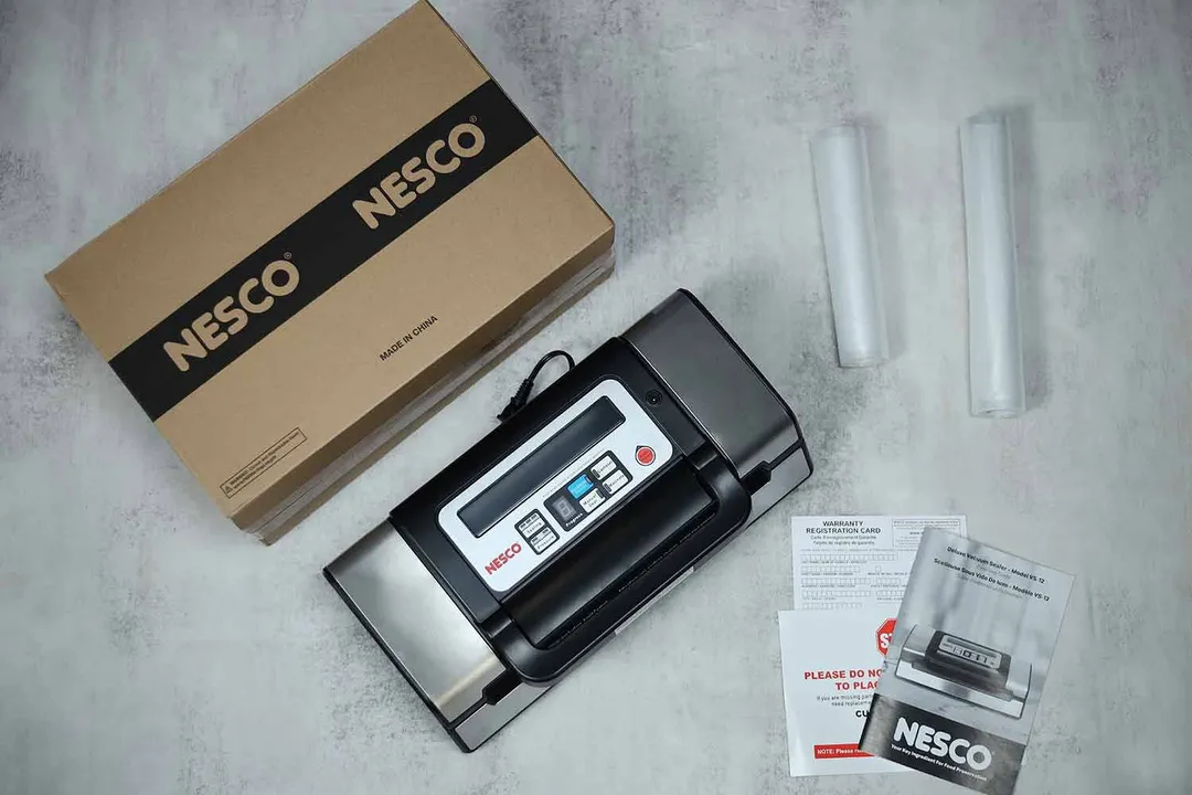 Besides the Nesco VS-12 itself, the shipping box also comes with rolls of plastic bags, instruction manual and warranty card.
