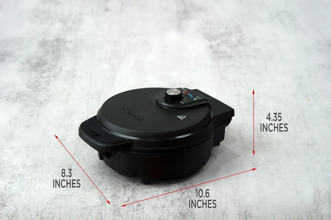 The dimensions of the Chefman waffle maker. The length is 10.6 inches, height 4.35 inches, and width 8.3 inches.