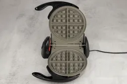 An overview of the Presto Flipside waffle maker’s gray, Belgian-style waffle plates.