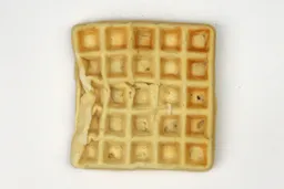 The pale gop top crust of a waffle baked for 10 minutes using a batter made from the Birch Benders mix.
