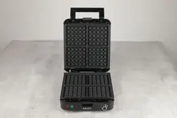 An overview of the KRUPS Belgian waffle maker’s black, non-stick-treated waffle plates.