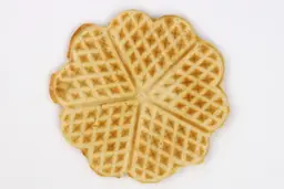 The light brown bottom crust of a waffle baked for 5 minutes 30 seconds using a batter made from the Birch Benders mix.
