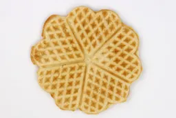 The light brown bottom crust of a waffle baked for 5 minutes 30 seconds using a batter made from the Birch Benders mix.
