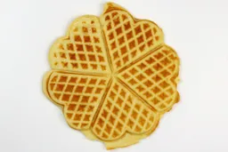 The light brown top crust of a waffle baked for 5 minutes 30 seconds using our self-mixed recipe.