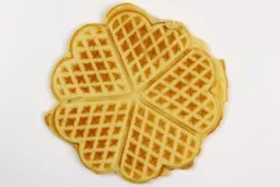 The light brown bottom crust of a waffle baked for 5 minutes 30 seconds using our self-mixed recipe.
