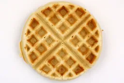 The light brown bottom crust of a waffle baked for 6 minutes 30 seconds using a batter made from the Birch Benders mix.
