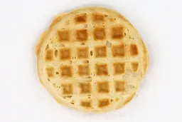 The pale gold bottom crust of a waffle baked for 8 minutes using a batter made from the Birch Benders mix.