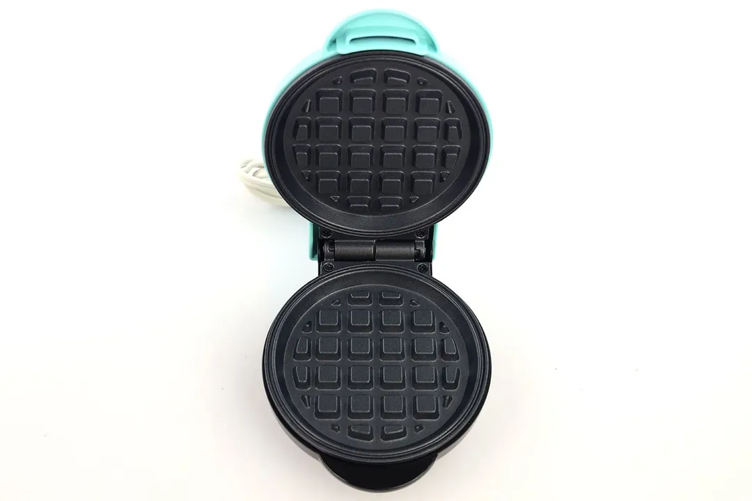 An overview of the Nostalgia MWF5AQ’s black, non-stick waffle plates.