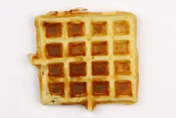 The golden - very dark brown bottom crust of a waffle baked for 3 minutes using our self-mixed recipe.
