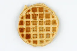 The very light gold top crust of a waffle baked for 5 minutes using a batter made from the Birch Benders mix.