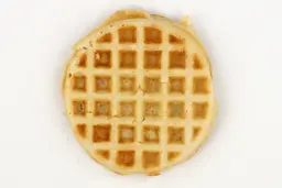 The very light gold bottom crust of a waffle baked for 5 minutes using a batter made from the Birch Benders mix.