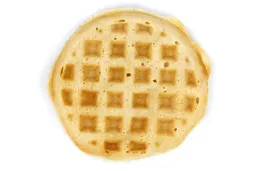 The pale gold top crust of a waffle baked for 8 minutes using a batter made from the Birch Benders mix