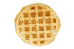 The pale gold bottom crust of a waffle baked for 8 minutes using a batter made from the Birch Benders mix