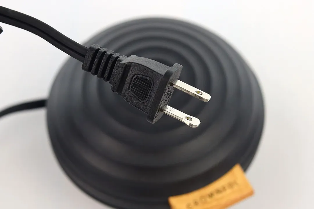 A zoomed-up view of the Crownful mini waffle maker’s power plug and its Type-A prongs.
