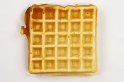 The very light gold bottom crust of a waffle baked for 7 minutes using our self-mixed recipe.