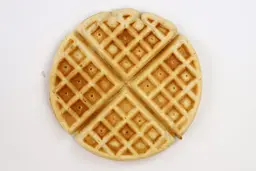 The pale gold top crust of a waffle cooked using the Birch Benders mix for 7 minutes.