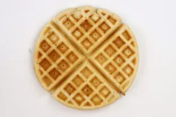 The pale gold top crust of a waffle cooked using the Birch Benders mix for 7 minutes.