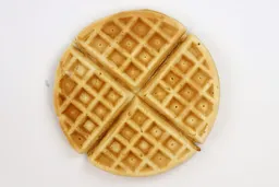 The pale gold bottom crust of a waffle cooked using the Birch Benders mix for 7 minutes.