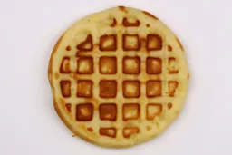 The light brown top crust of a waffle baked for 6 minutes using our self-mixed recipe.