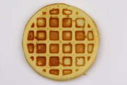 The light brown bottom crust of a waffle baked for 6 minutes using our self-mixed recipe.
