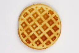 The light brown bottom crust of a waffle baked in 5 minutes using our self-mixed recipe.