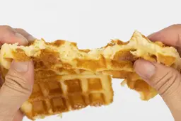 The 3-minute waffle being torn by hand down the middle to test it for consistency and texture.