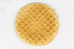 The bottom golden crust of a waffle baked for 4 minutes using a batter made from the Birch Benders mix.
