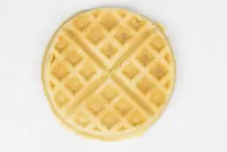 The light brown top crust of a waffle baked for 7 minutes using our Birch Benders batter.